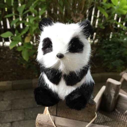 Panda der sidder på bagen 