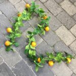 Kunstig dekorativ appelsin ranke