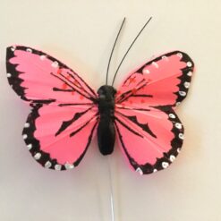 Lille lyserød dekorativ sommerfugl