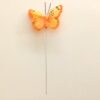 Orange sommerfugl på pind