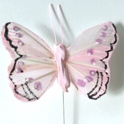 Sart rosa lille sommerfugl