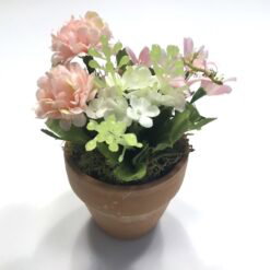 Dekorativ pastelfarvet potte blomst